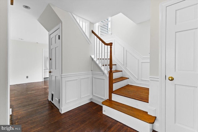 stairs with hardwood / wood-style flooring