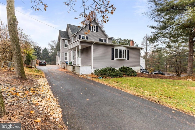 view of home's exterior with a yard