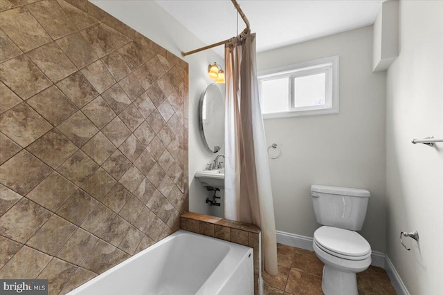 bathroom featuring toilet and shower / bath combo with shower curtain