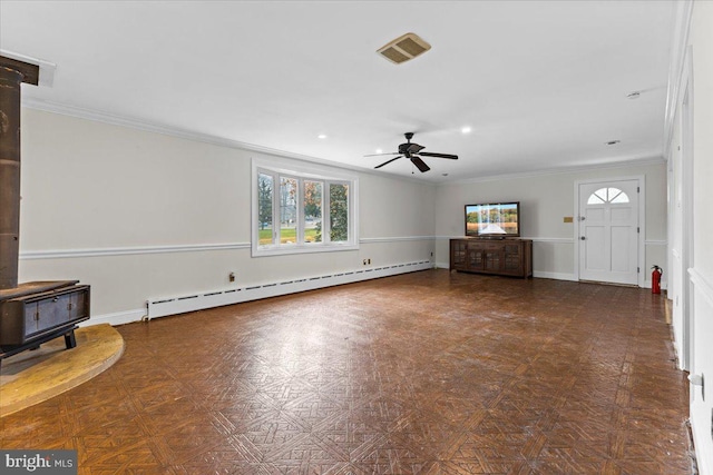 unfurnished living room featuring ornamental molding, ceiling fan, and a baseboard heating unit