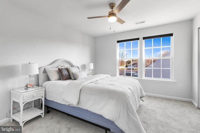 carpeted bedroom with ceiling fan