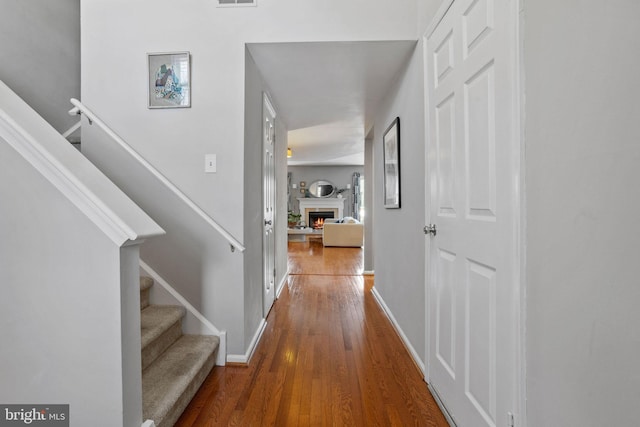 corridor with wood-type flooring