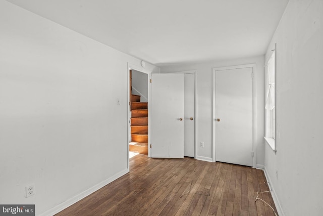 empty room with hardwood / wood-style flooring