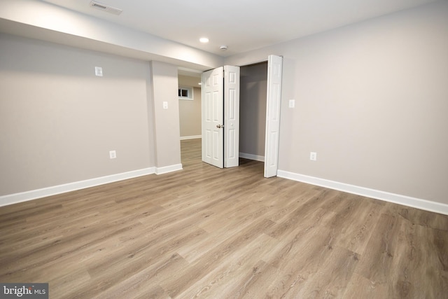 basement featuring light wood-type flooring