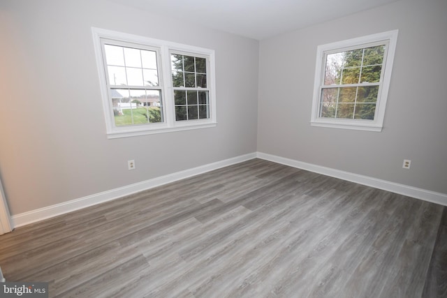 spare room featuring dark hardwood / wood-style flooring