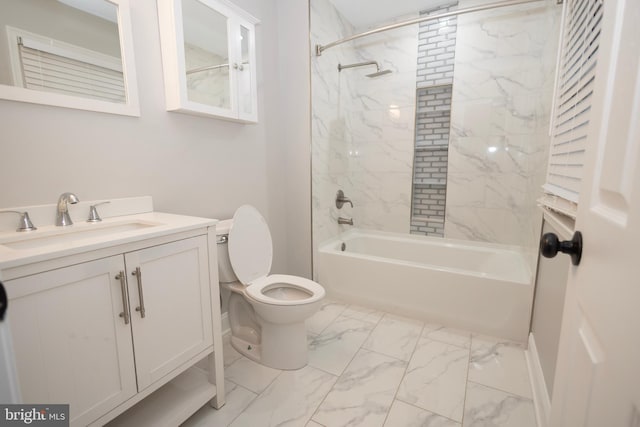 full bathroom with vanity, tiled shower / bath combo, and toilet