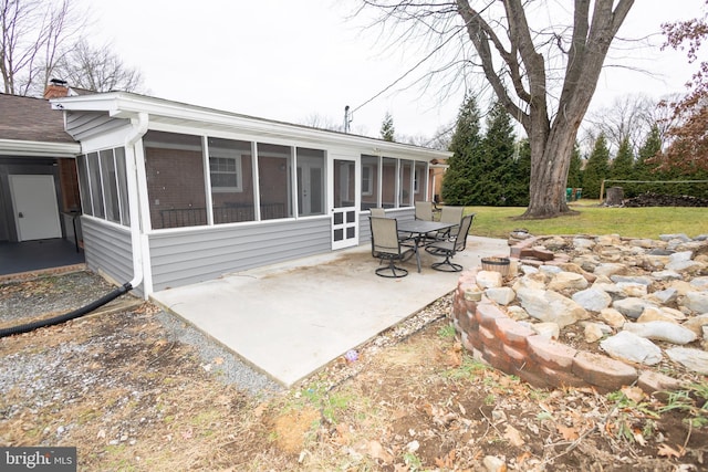 view of patio / terrace with a sunroom