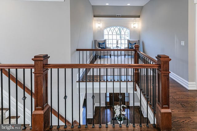 staircase featuring recessed lighting, wood finished floors, visible vents, and baseboards