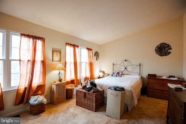 bedroom featuring light carpet