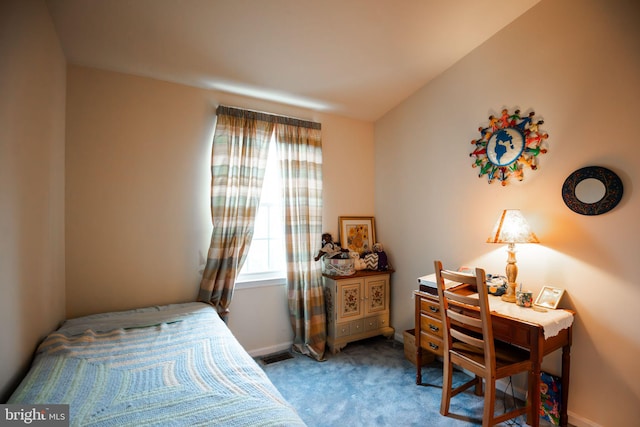 carpeted bedroom with vaulted ceiling