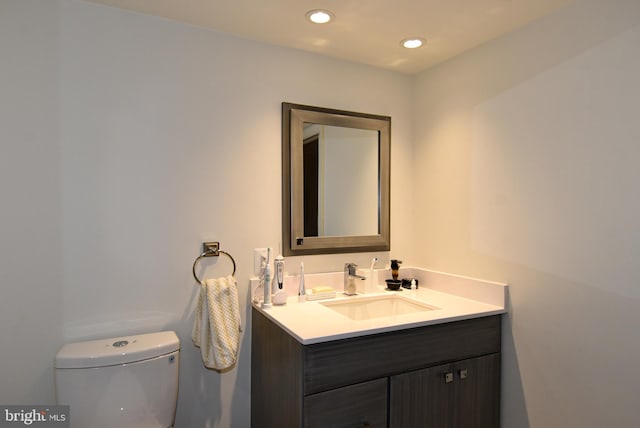 bathroom with vanity and toilet