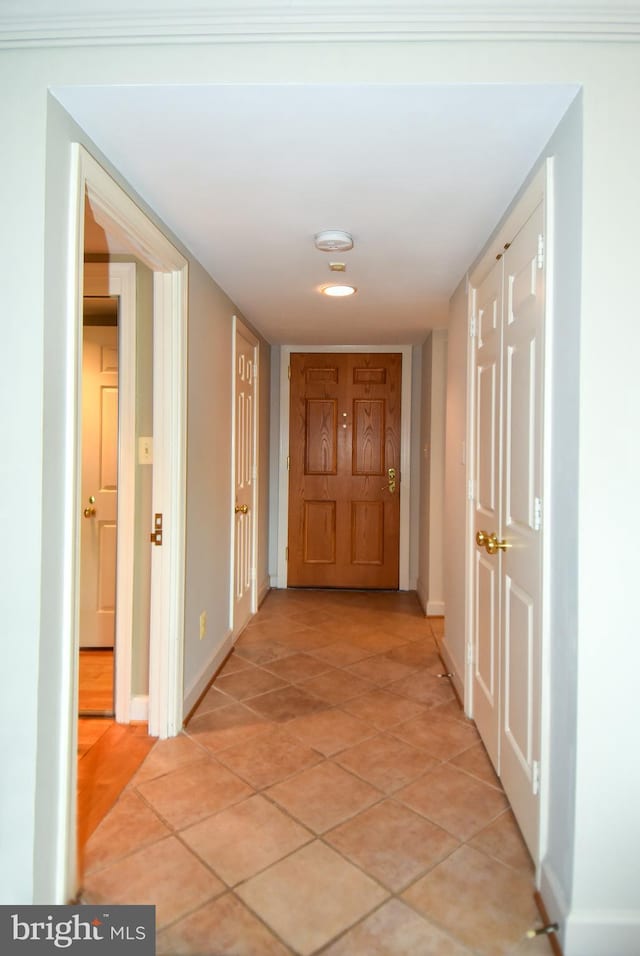 corridor with light tile patterned floors