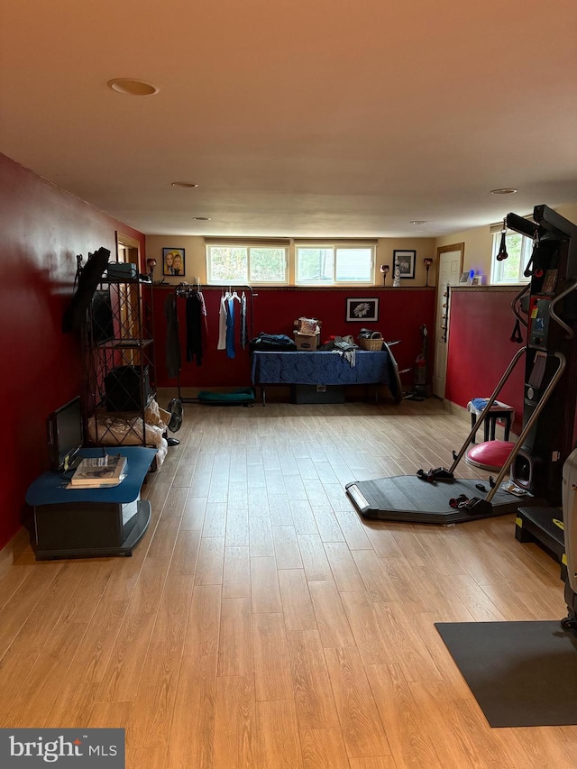 exercise area featuring hardwood / wood-style flooring