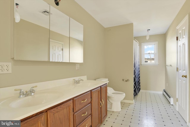 bathroom with a shower with shower curtain, tile patterned floors, vanity, a baseboard heating unit, and toilet