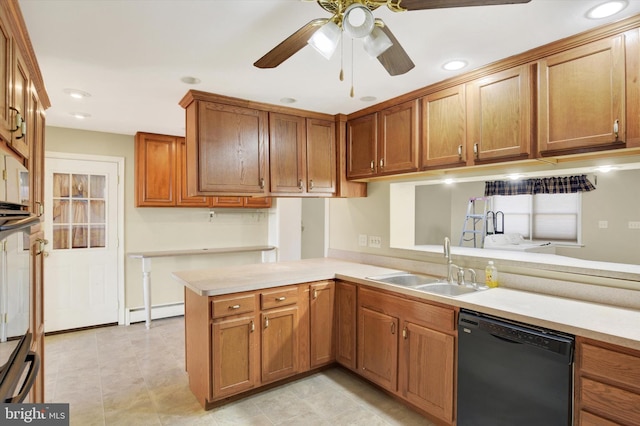 kitchen featuring ceiling fan, dishwasher, sink, a baseboard heating unit, and kitchen peninsula