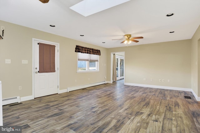 unfurnished room featuring wood-type flooring, a skylight, baseboard heating, and ceiling fan