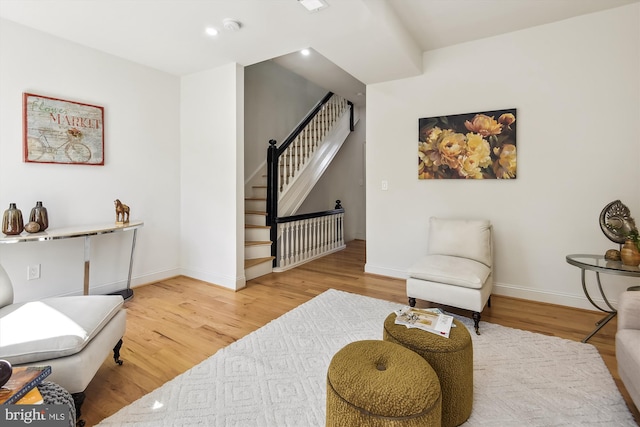 living area featuring hardwood / wood-style floors