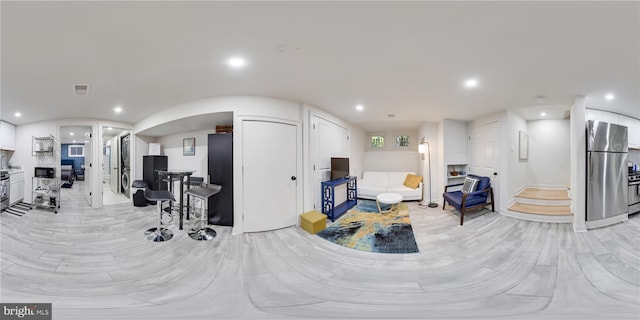 living room with light hardwood / wood-style flooring