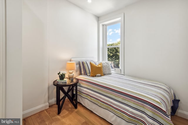 bedroom with light hardwood / wood-style floors