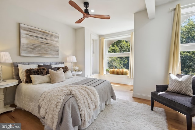 bedroom featuring ceiling fan and light hardwood / wood-style flooring