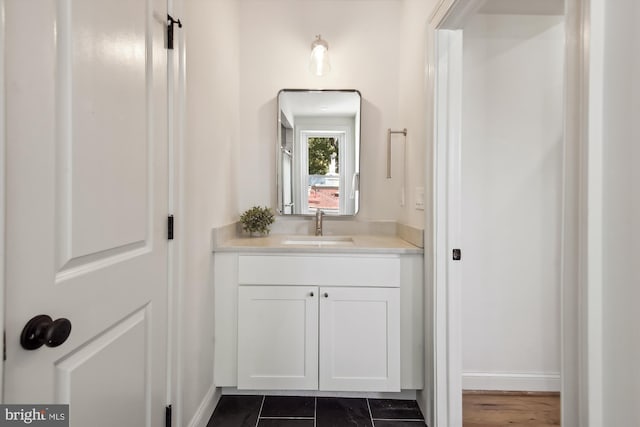 bathroom with tile patterned floors and vanity