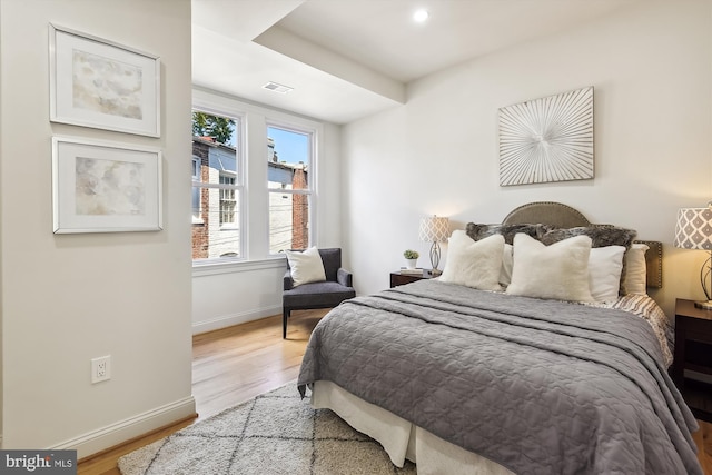 bedroom with light hardwood / wood-style flooring