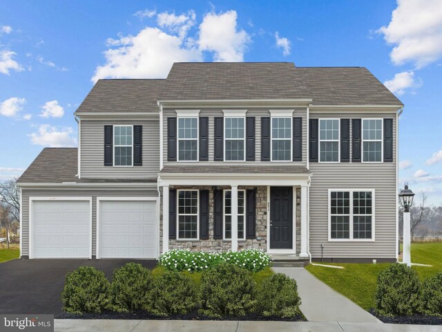 colonial-style house featuring a garage