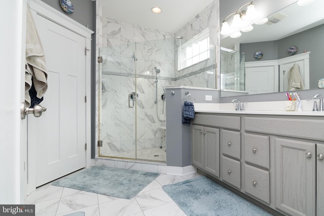 bathroom featuring vanity and a shower with shower door