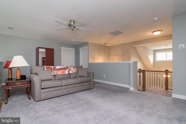 carpeted living room with ceiling fan