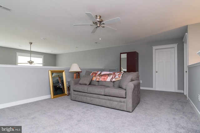 living room featuring ceiling fan and light carpet