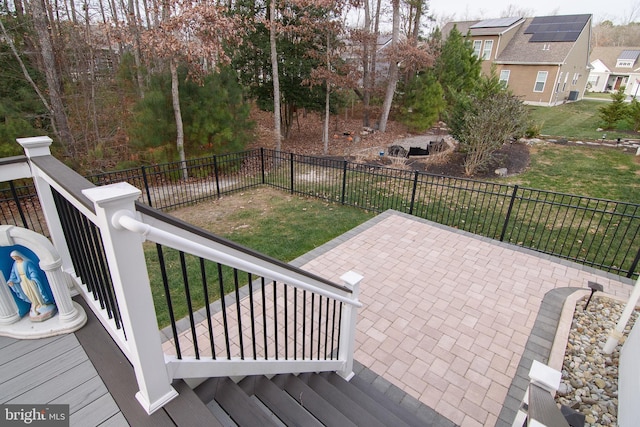 wooden terrace with a patio area and a yard