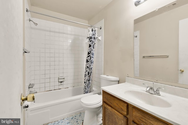 full bathroom featuring vanity, toilet, and shower / tub combo with curtain