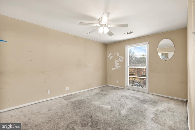 unfurnished room with ceiling fan and light colored carpet