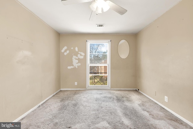 unfurnished room with light carpet and ceiling fan