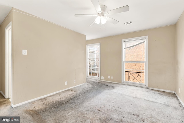 spare room with ceiling fan and light colored carpet