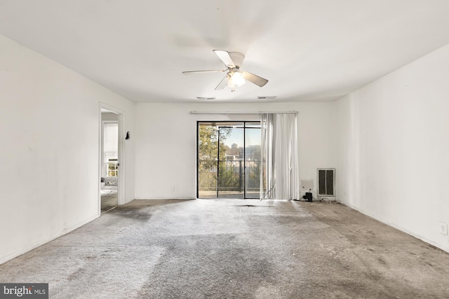 spare room with ceiling fan and carpet floors