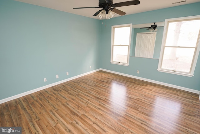 empty room featuring ceiling fan and wood-type flooring