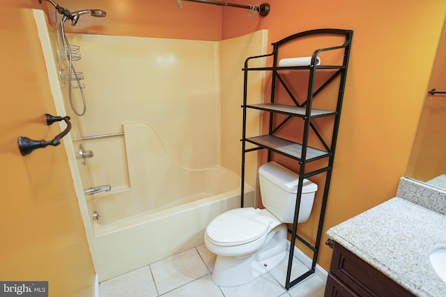 full bathroom with toilet, vanity, tile patterned floors, and washtub / shower combination