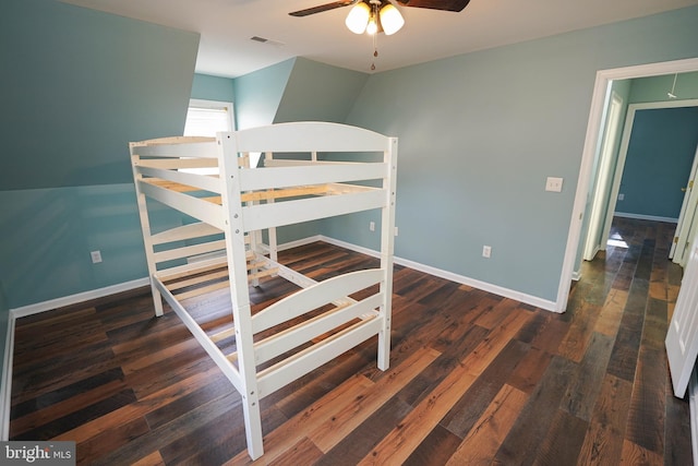 bedroom featuring ceiling fan and dark wood-type flooring