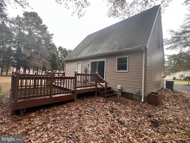 back of property with a wooden deck