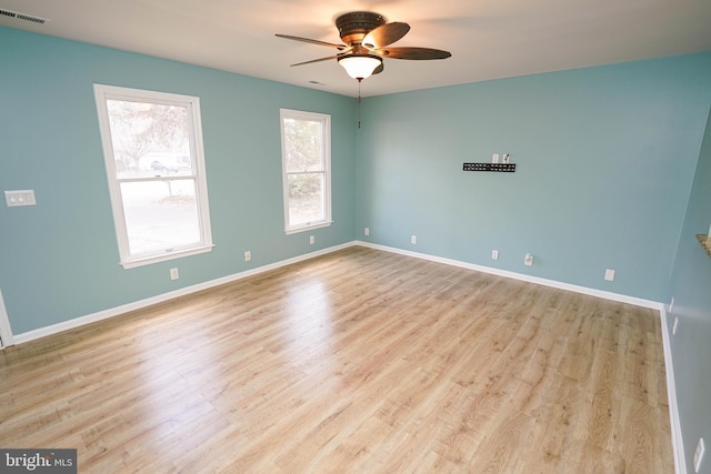 spare room with ceiling fan and light hardwood / wood-style flooring