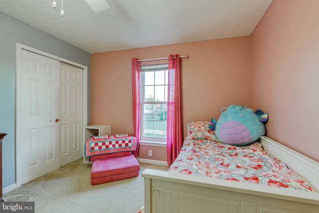 bedroom featuring carpet flooring, ceiling fan, and a closet