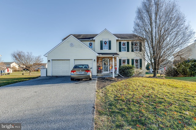 front of property featuring a garage and a front yard