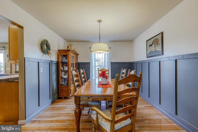 dining area with light hardwood / wood-style flooring