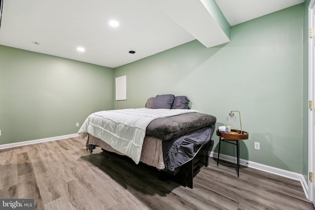 bedroom featuring wood-type flooring