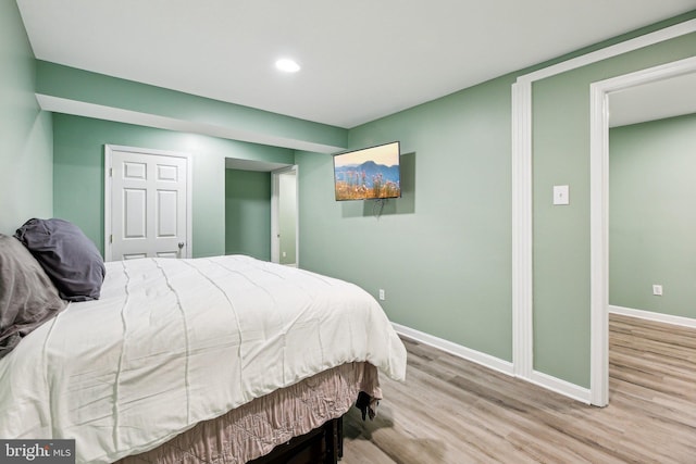 bedroom with light wood-type flooring