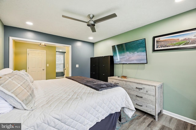 bedroom with hardwood / wood-style flooring and ceiling fan