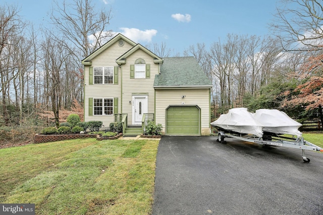 front facade with a garage and a front yard