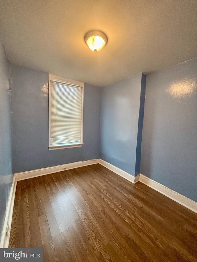 spare room featuring hardwood / wood-style floors