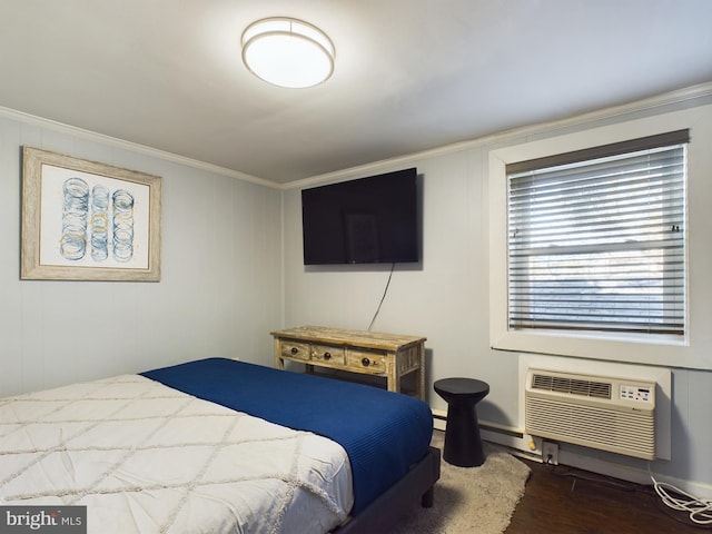 bedroom with an AC wall unit, crown molding, and dark wood-type flooring